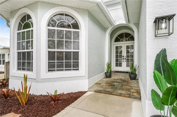 Property entrance featuring french doors