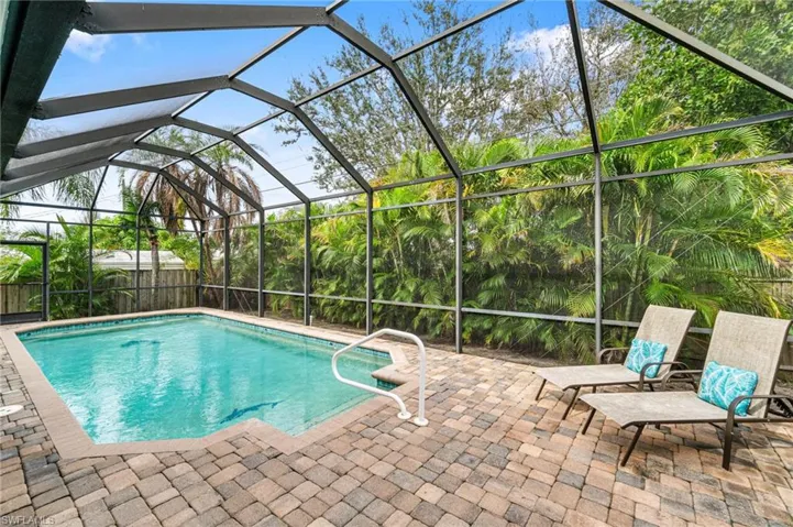View of pool featuring a lanai and a patio