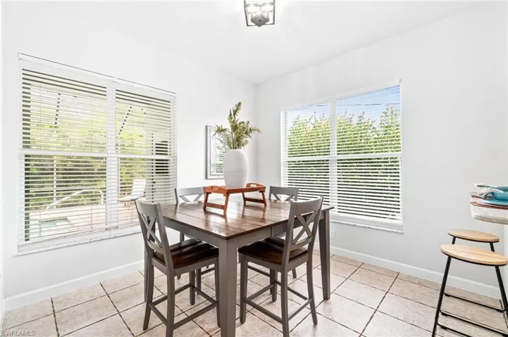 Dining area with light tile floors