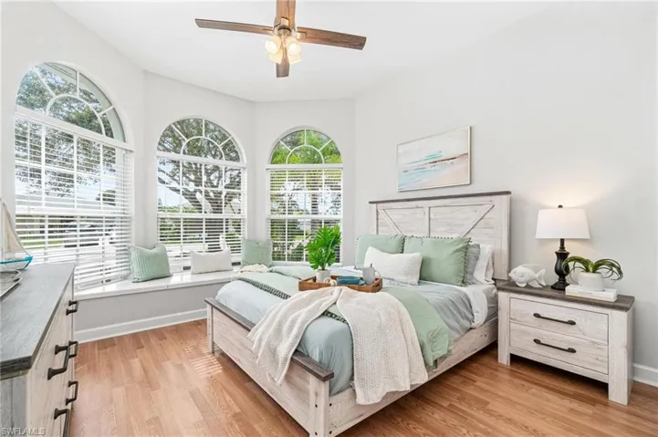 Bedroom featuring light wood-type flooring and ceiling fan