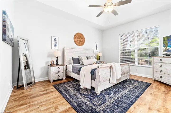 Bedroom featuring ceiling fan and light hardwood / wood-style floors