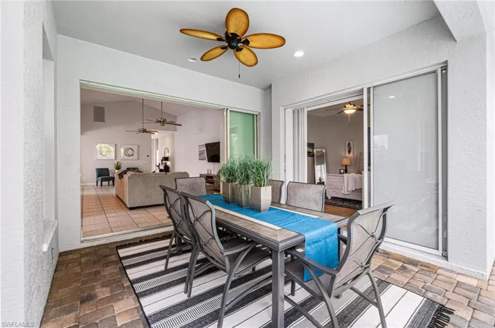 Dining space with tile flooring and ceiling fan