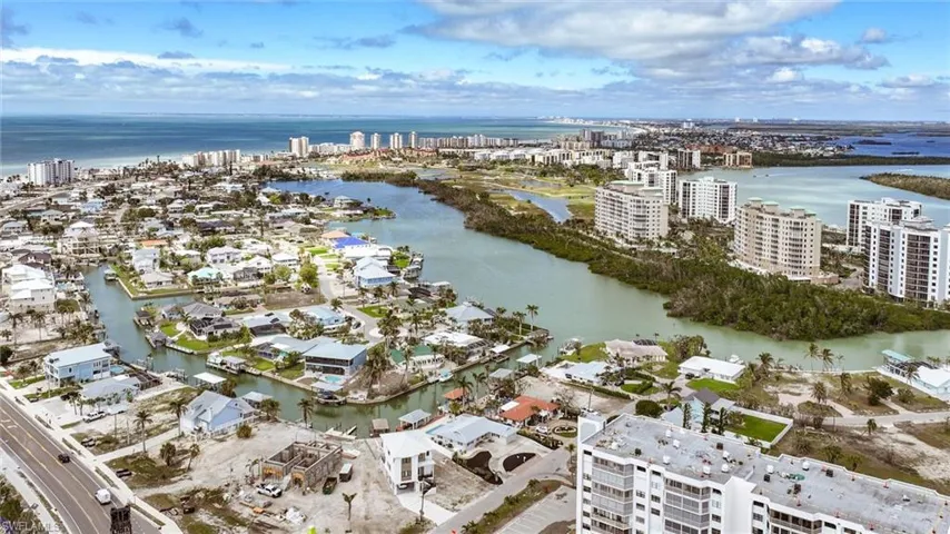 Drone / aerial view with a water view and a city view