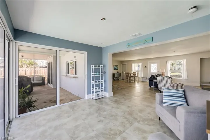 Living area featuring visible vents and baseboards
