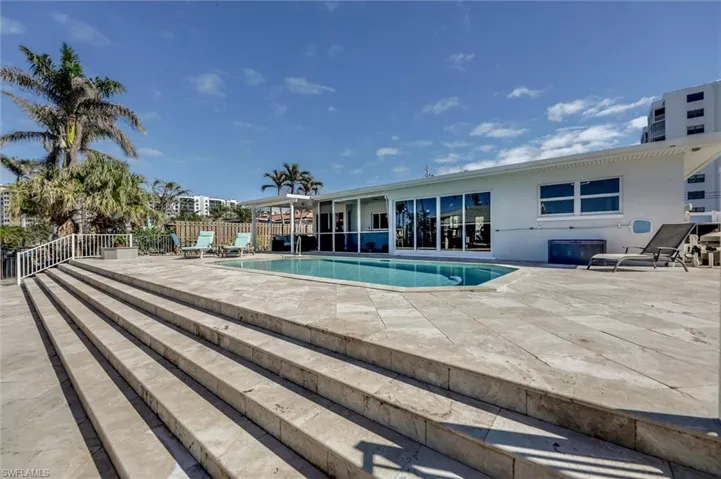 View of pool with a fenced in pool, a patio, and fence