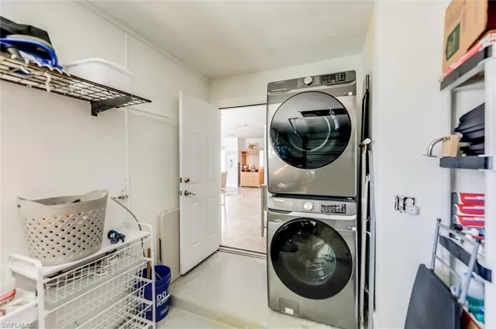 Clothes washing area with laundry area and stacked washer / drying machine
