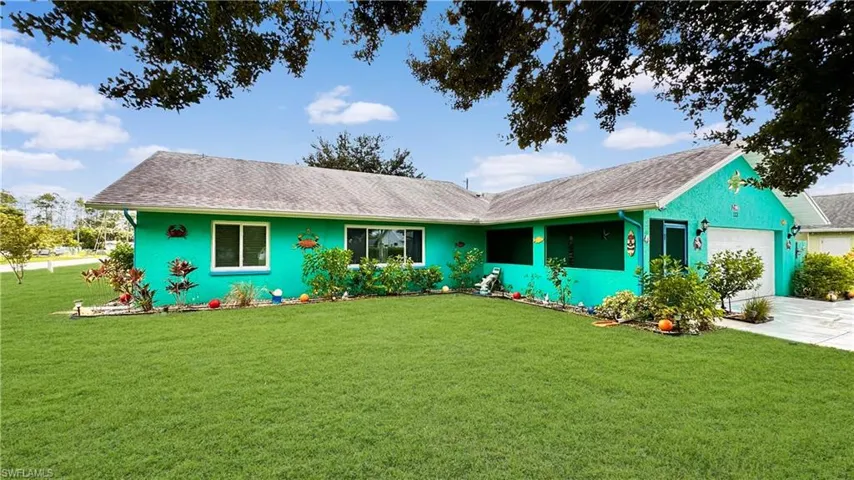 Ranch-style home with a garage and a front yard