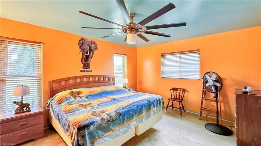 Bedroom featuring ceiling fan and light tile patterned floors