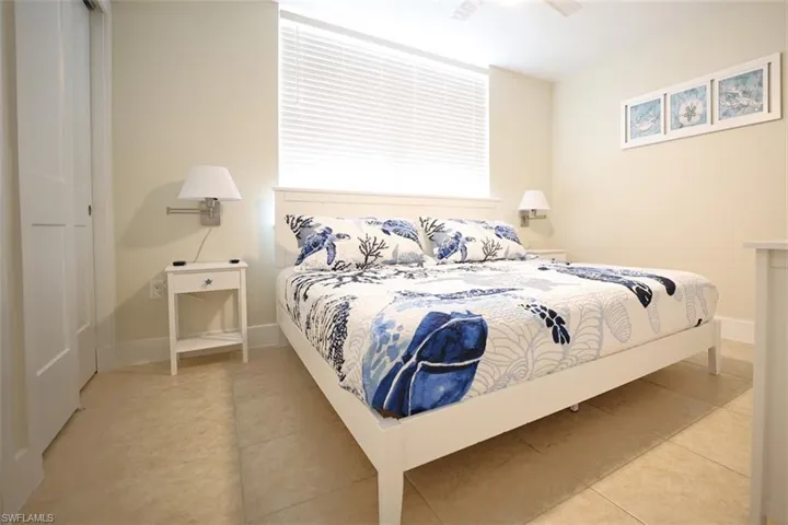 Bedroom featuring ceiling fan and light tile patterned floors