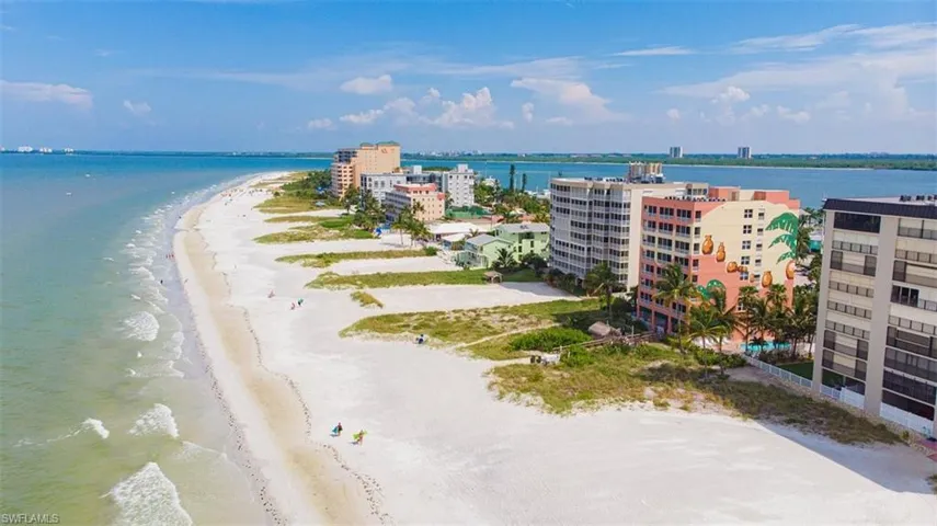 Bird's eye view with a water view and a beach view