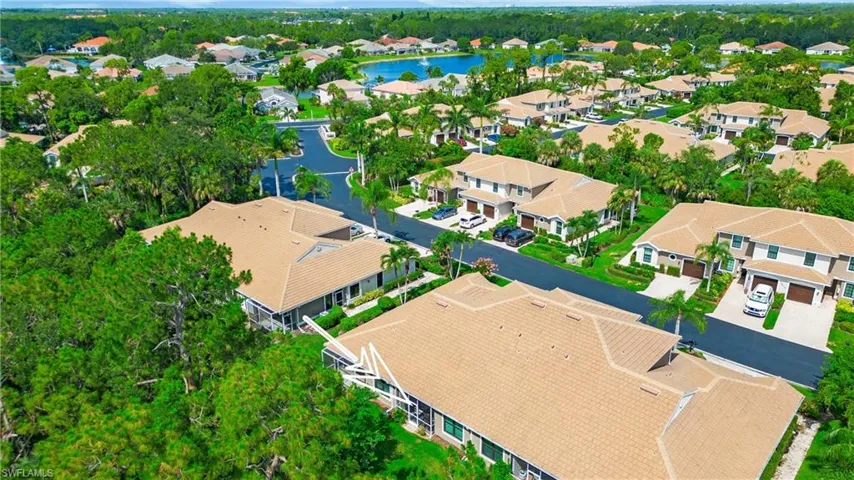 Aerial view of residential area featuring a large body of water