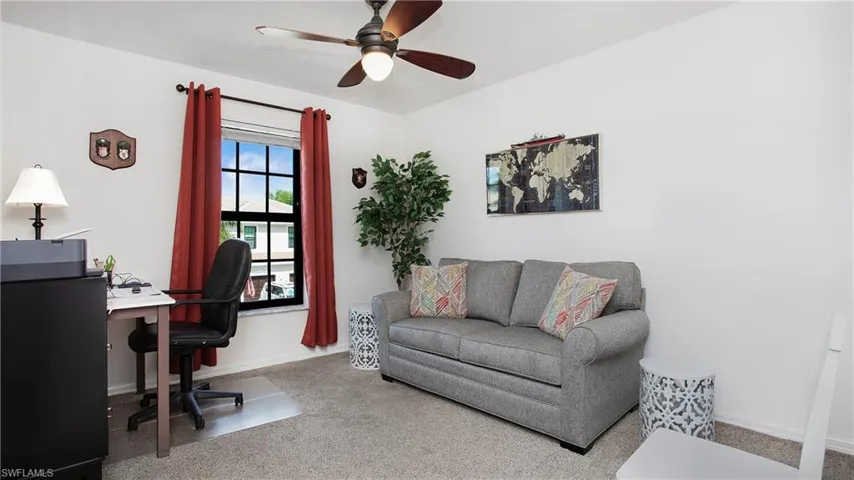 Guest bedroom 2nd floor. Carpeted office with ceiling fan and baseboards
