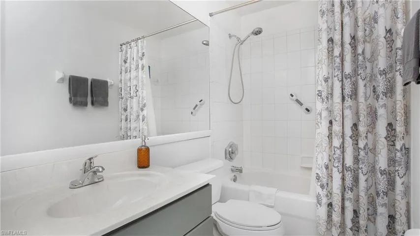 Bathroom featuring vanity and shower / bath combo