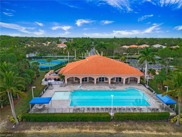 Community pool with a patio