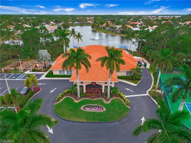 Aerial view of property and surrounding area featuring a large body of water