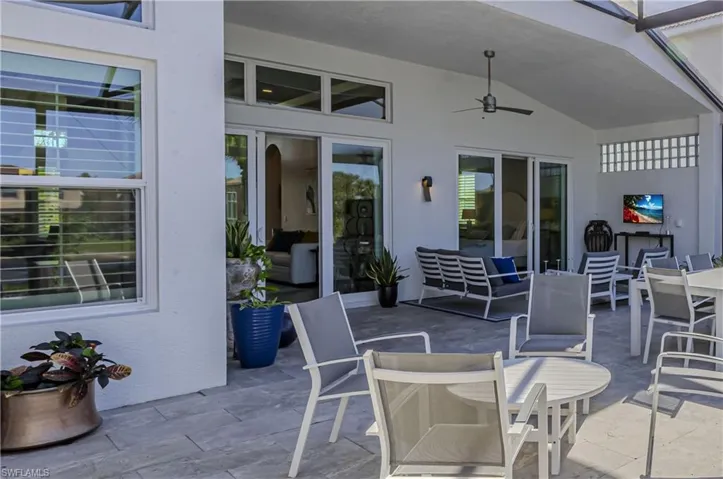 View of patio featuring a ceiling fan and outdoor dining area