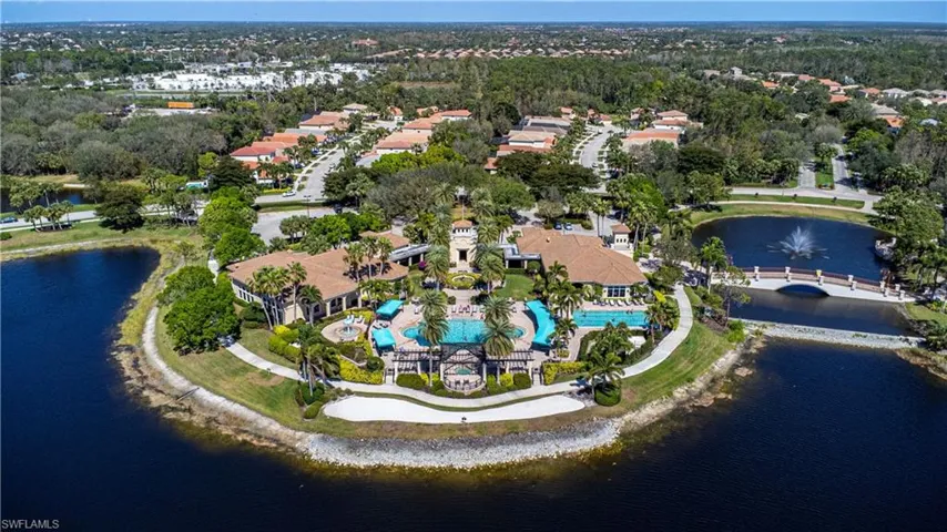 View of property location with a large body of water and a pool