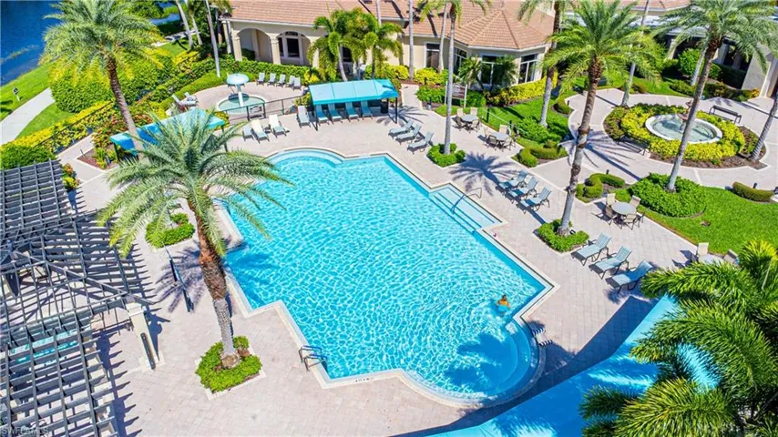 Community pool with a patio