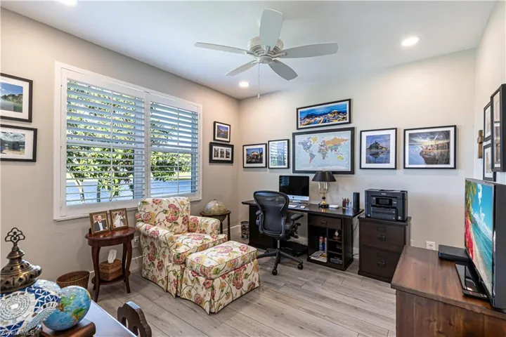 Office with a ceiling fan, light wood-style flooring, and recessed lighting