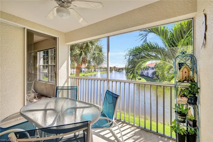 Sunroom / solarium with a water view
