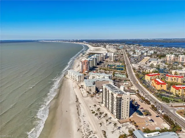 Drone / aerial view with a water view and a view of the beach