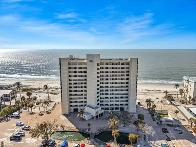Bird's eye view with a water view and a beach view