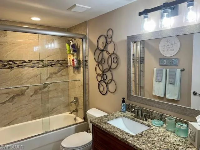 Guest Bathroom- Tastely updated with New Cabinet, Granite, Tile, Lighting Fixture and Mirror.