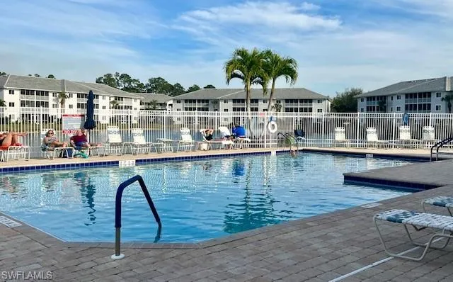 Blue Heron community Pool overlooking small lake.