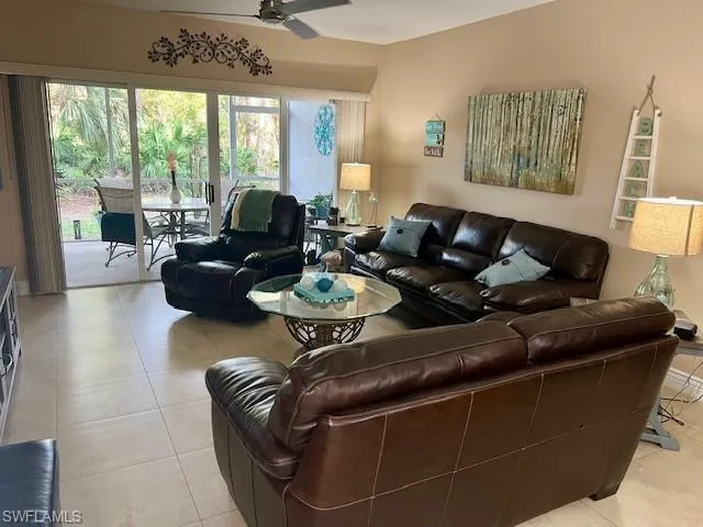 Spacious Living room overlooking preserve.  Couch, loveseat, chair, cocktail table and matching end tables are being sold with the property.