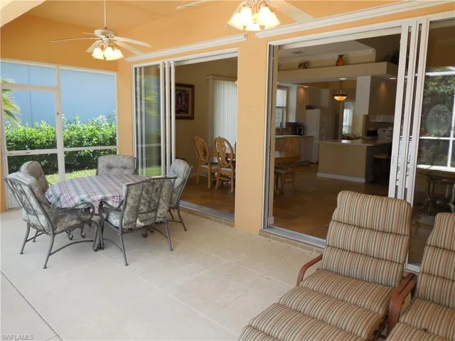 Sunroom featuring ceiling fan