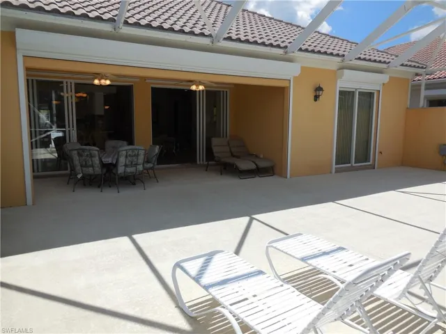 Back of property with a patio