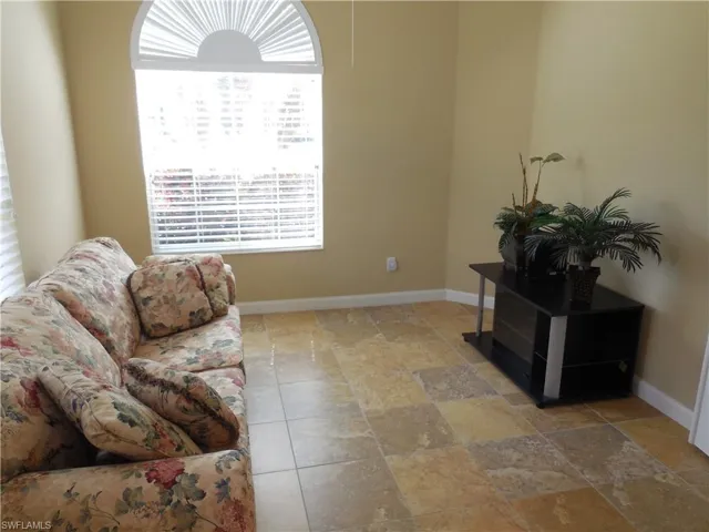 Living room featuring light tile patterned flooring