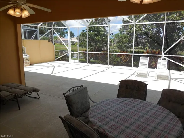 Sunroom featuring ceiling fan