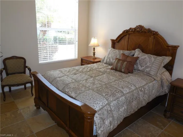 Bedroom with tile patterned floors