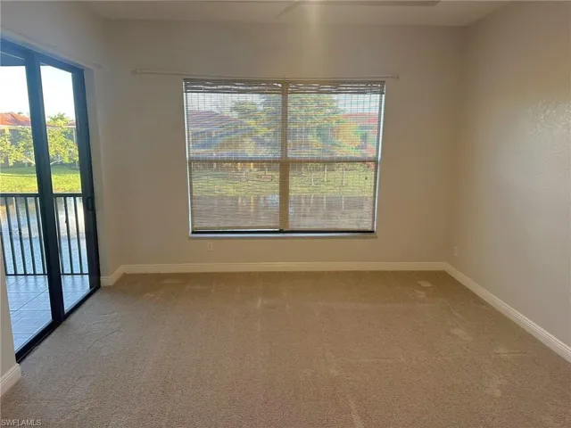 Wake to the peaceful sound of the lake fountain in this large bedroom with two closets. Prentiss Pointe Condo for sale in Fort Myers Florida