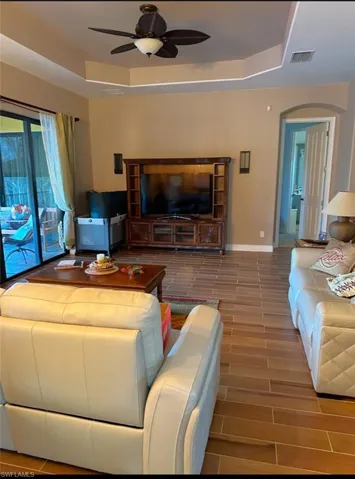 Livingroom is renovated with new wood grain tile. Prentiss Pointe Condo for sale in Fort Myers Florida