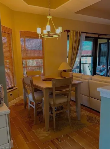 Dining room offers lake views just off the kitchen which has new appliances and new wood grain tile floors that extend throughout the living area. Prentiss Pointe Condo for sale in Fort Myers Florida