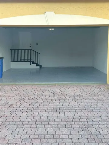 Two-car garage under the den is steps from the private elevator and has a new floor. Prentiss Pointe Condo for sale in Fort Myers Florida