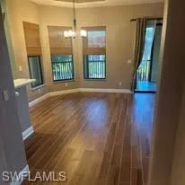 Dining room offers lake views just off the kitchen which has new appliances and new wood grain tile floors that extend throughout the living area. Prentiss Pointe Condo for sale in Fort Myers Florida