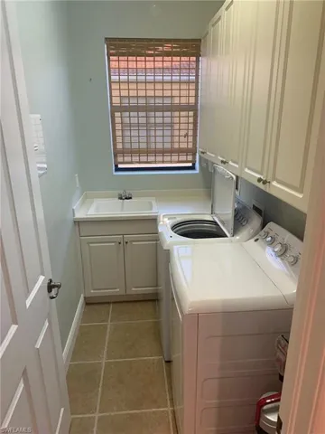 Full laundry facilities including a sink and storage are included in this fully remodeled condo with new air conditioner, hot water heater, appliances, baths, and flooring is ready for you. Prentiss Pointe Condo for sale in Fort Myers Florida