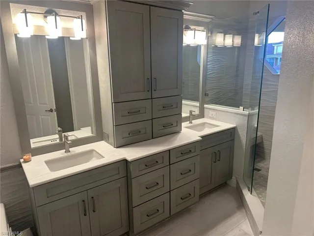 New vanity area with dual sinks provides space and comfort. Prentiss Pointe Condo for sale in Fort Myers Florida