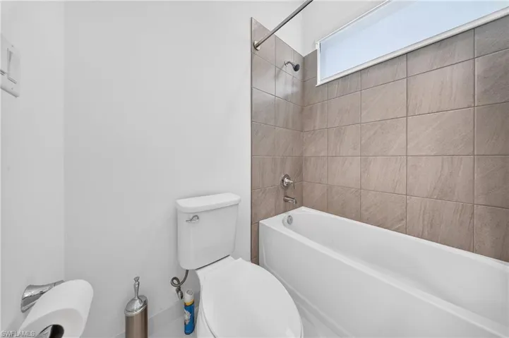 White porcelain toilet and bathtub