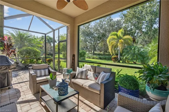 Sunroom with a ceiling fan, a patio, and an outdoor hangout area