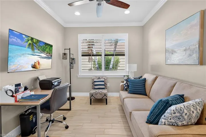 Office with crown molding, wood finished floors, recessed lighting, and ceiling fan
