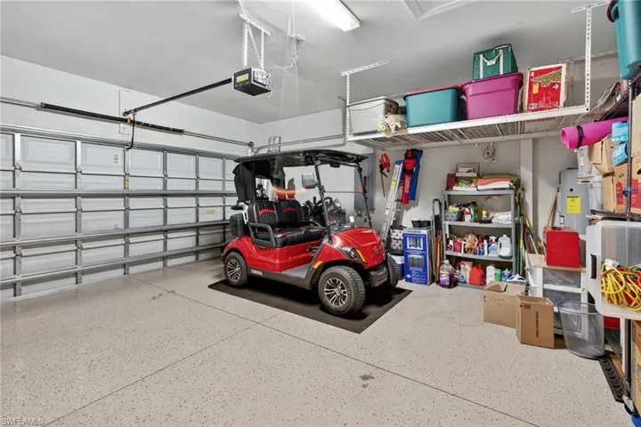 Garage with a garage door opener and water heater