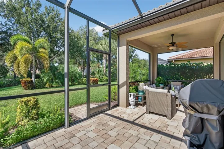 Sunroom with a ceiling fan, outdoor lounge area, and a patio