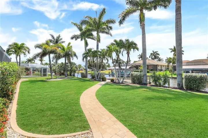 The lot is oversized and lavishly landscaped