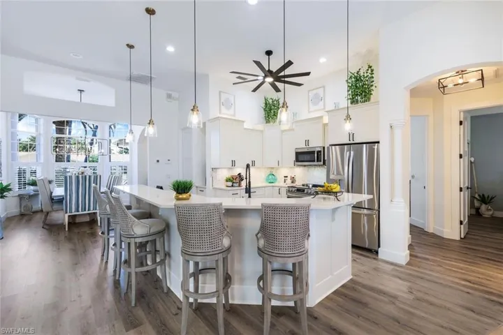 The Kitchen island/breakfast bar has custom wood trim