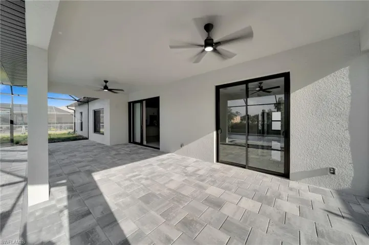 View of patio featuring ceiling fan