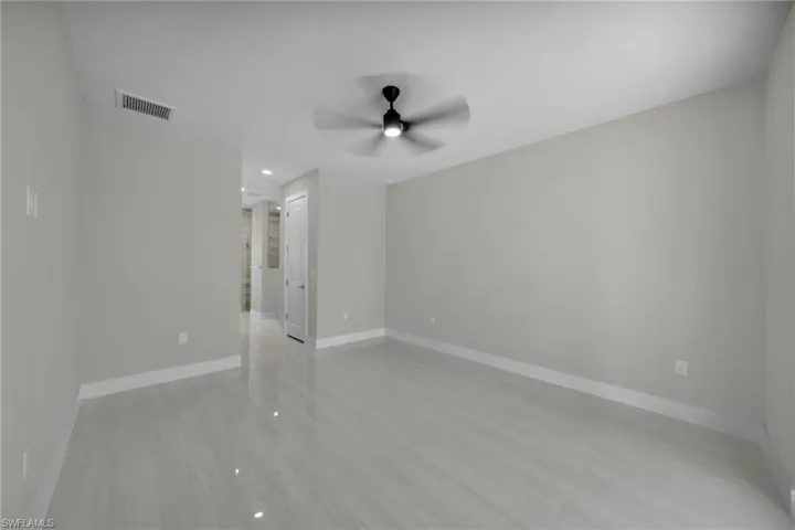 Empty room with a ceiling fan, baseboards, and recessed lighting